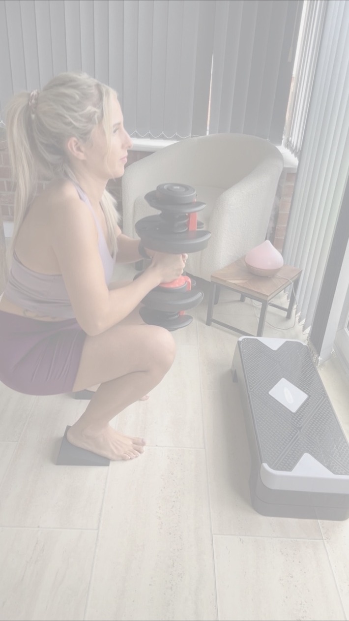 A client practising a strengthening exercise in the clinic